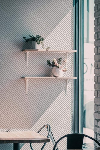 Industrial style cafe decorated with Wavy stripe pattern peel and stick wallpaper