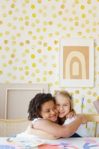Fancy Walls self-adhesive wallpaper featuring playful yellow dots on white