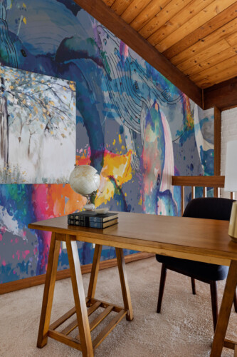Fancy Walls Watercolor Abstract Whales peel and stick wall mural with bold colorful aquatic design.