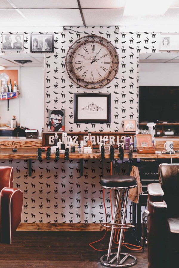 Fancy Walls peel and stick wallpaper with black and white cats and bats.