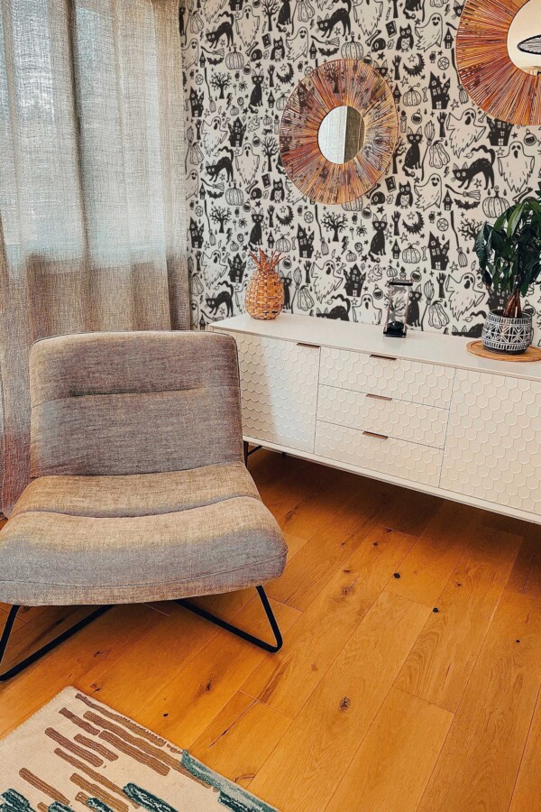 Fancy Walls peel and stick wallpaper with cute Halloween doodles in black and white.