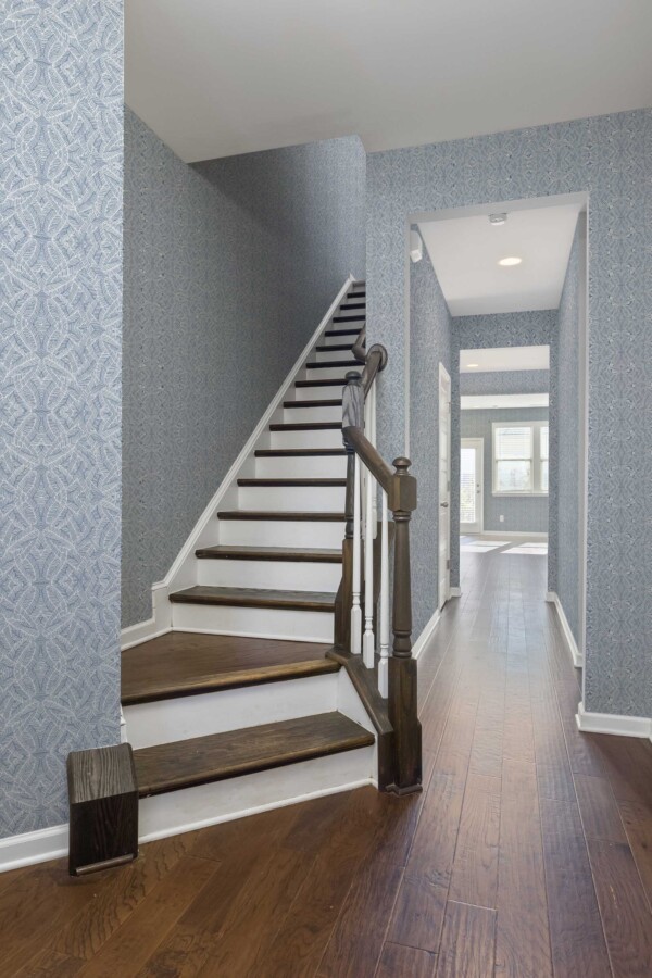 Removable wallpaper featuring intricate blue stripes from Fancy Walls