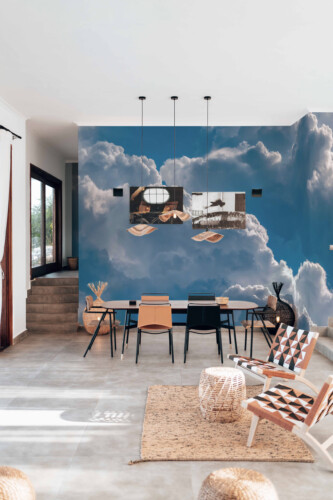 Fluffy Clouds Wall Mural with bold white clouds on a blue sky, ideal for calming living room interiors.