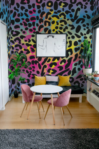 Funky Rainbow Leopard Wall Mural with bold colorful gradients and black leopard print, ideal for vibrant living room interiors.
