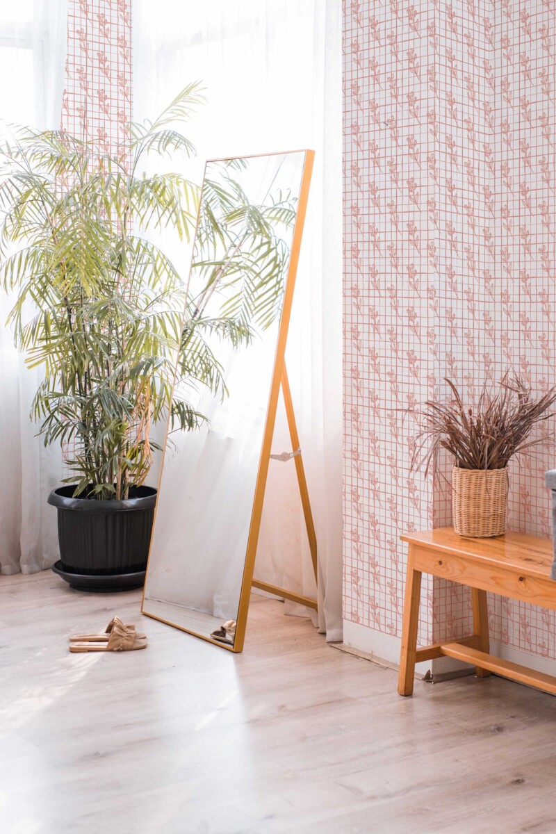 Fancy Walls self-adhesive wallpaper featuring delicate coral florals on white background