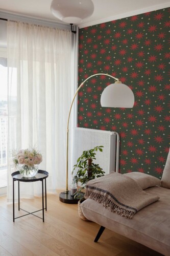 Fancy Walls peel and stick wallpaper with cute Christmas stars in green and red.