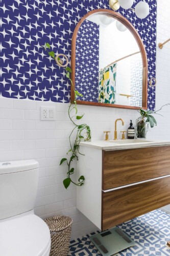 Fancy Walls self-adhesive wallpaper featuring celestial navy stars on blue background.