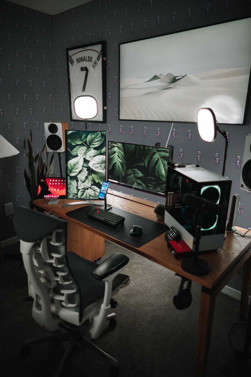 Fancy Walls removable wallpaper decorated with gray dancing pixel skeleton characters.