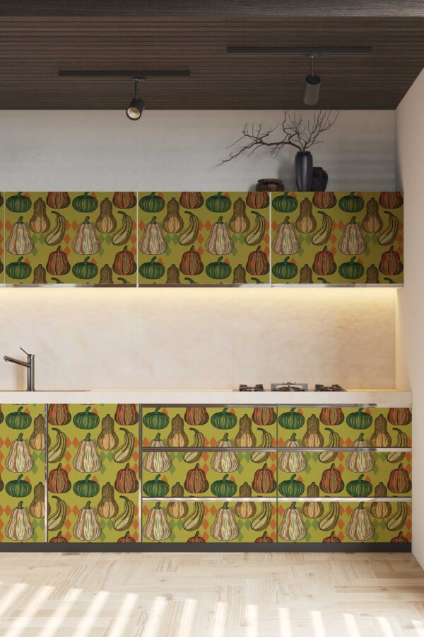 Fancy Walls removable wallpaper with orange pumpkins and green autumn leaves.