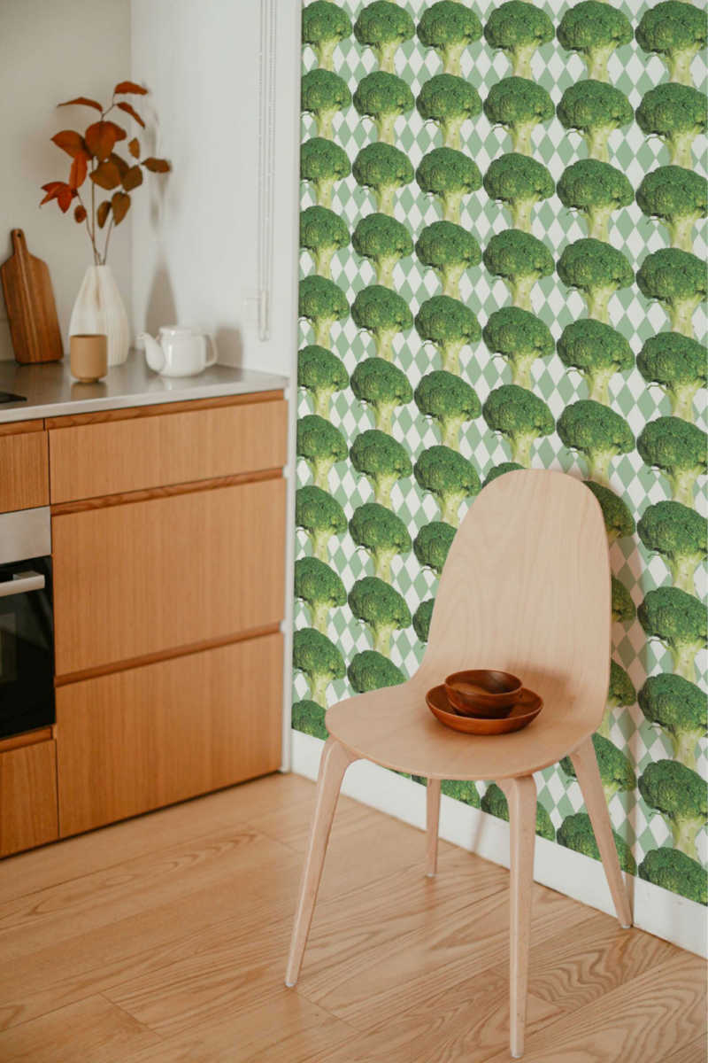 Funny broccoli peel and stick wallpaper in a bright kitchen interior with wooden accents