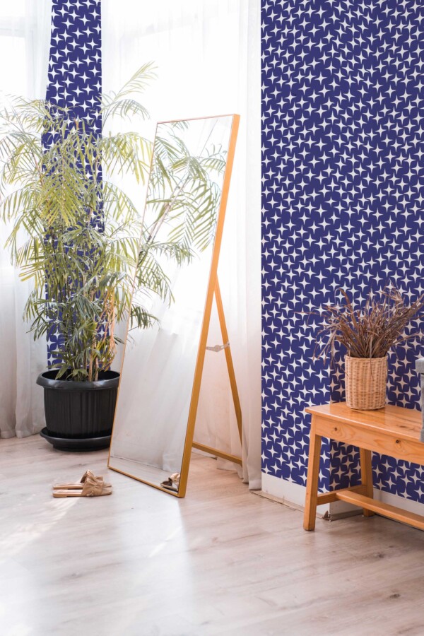 Fancy Walls traditional wallpaper styled with irregular navy star motifs.
