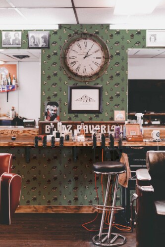 Fancy Walls peel and stick wallpaper with aesthetic green skull pattern