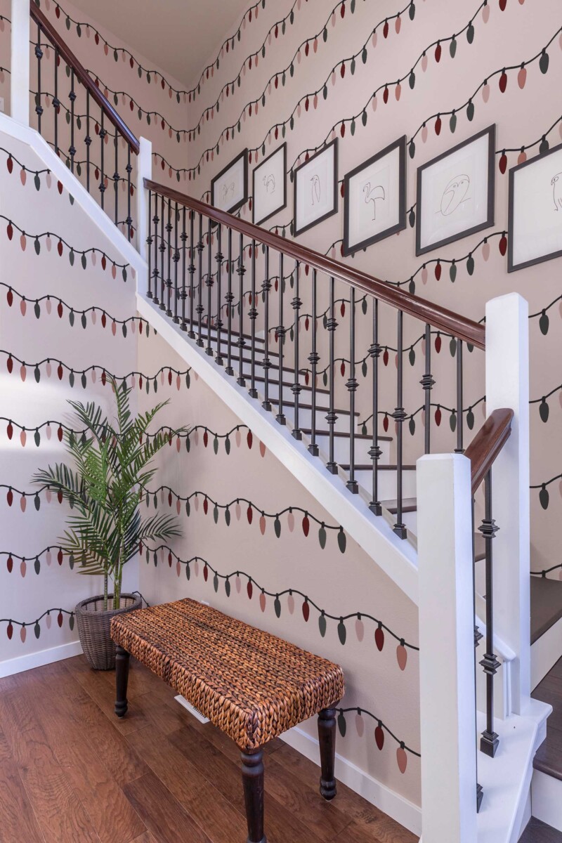Self-adhesive wallpaper from Fancy Walls featuring festive pastel string lights