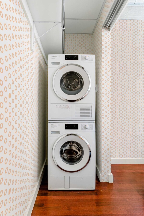 Traditional wallpaper in peach and white dotted pattern by Fancy Walls