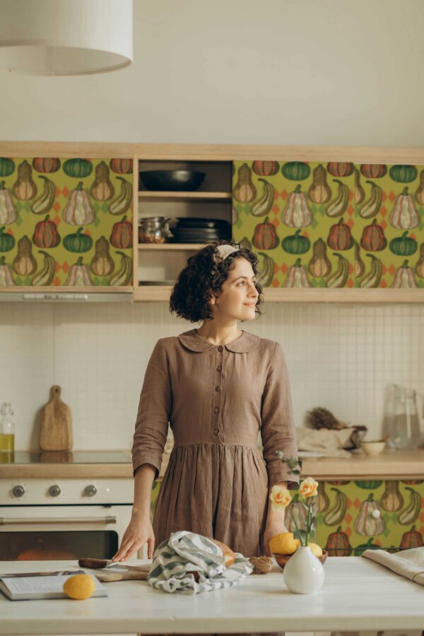 Fancy Walls peel and stick wallpaper with Pumpkin Spiced Kitchen design in green and orange.