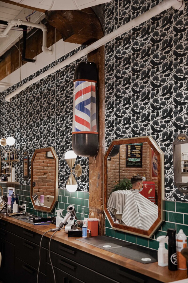 Fancy Walls removable wallpaper with scary skulls and crows design in black and white.