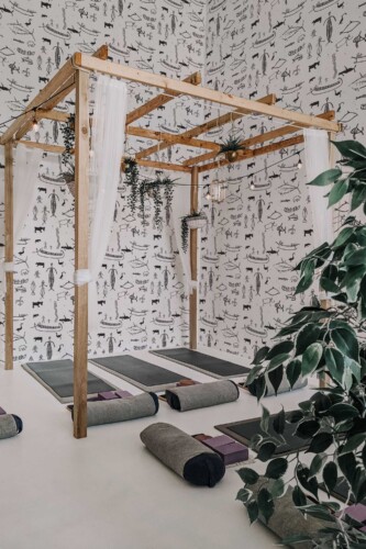 Black and white peel and stick wallpaper with ancient cave illustrations by Fancy Walls