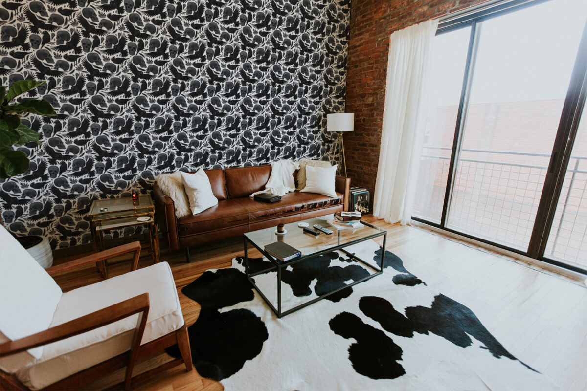Skulls and crows peel and stick wallpaper in deep black with white gothic motifs for bold modern creative spaces