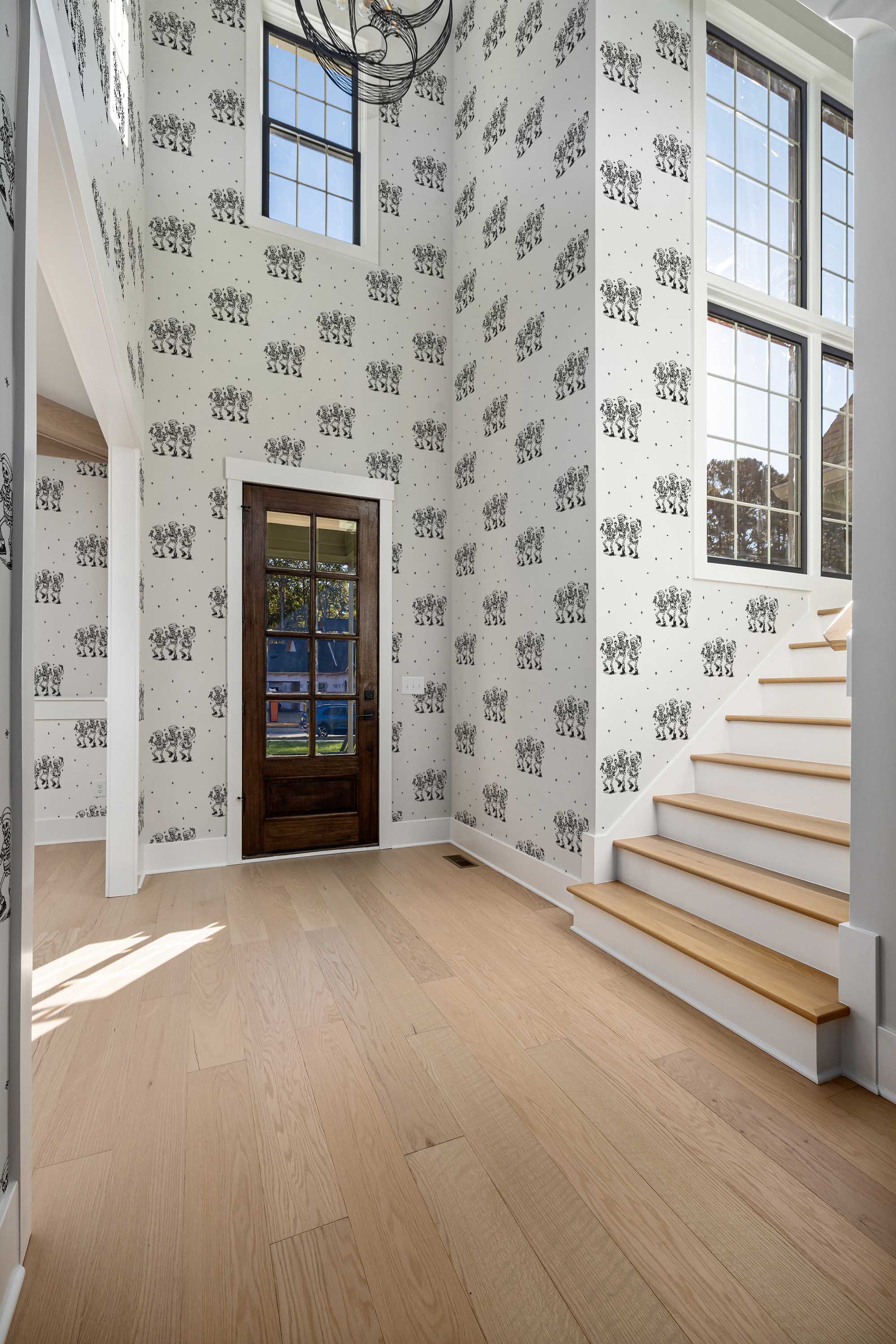 Fancy Walls peel and stick wallpaper featuring black and white dancing skeletons for a quirky Christmas look.