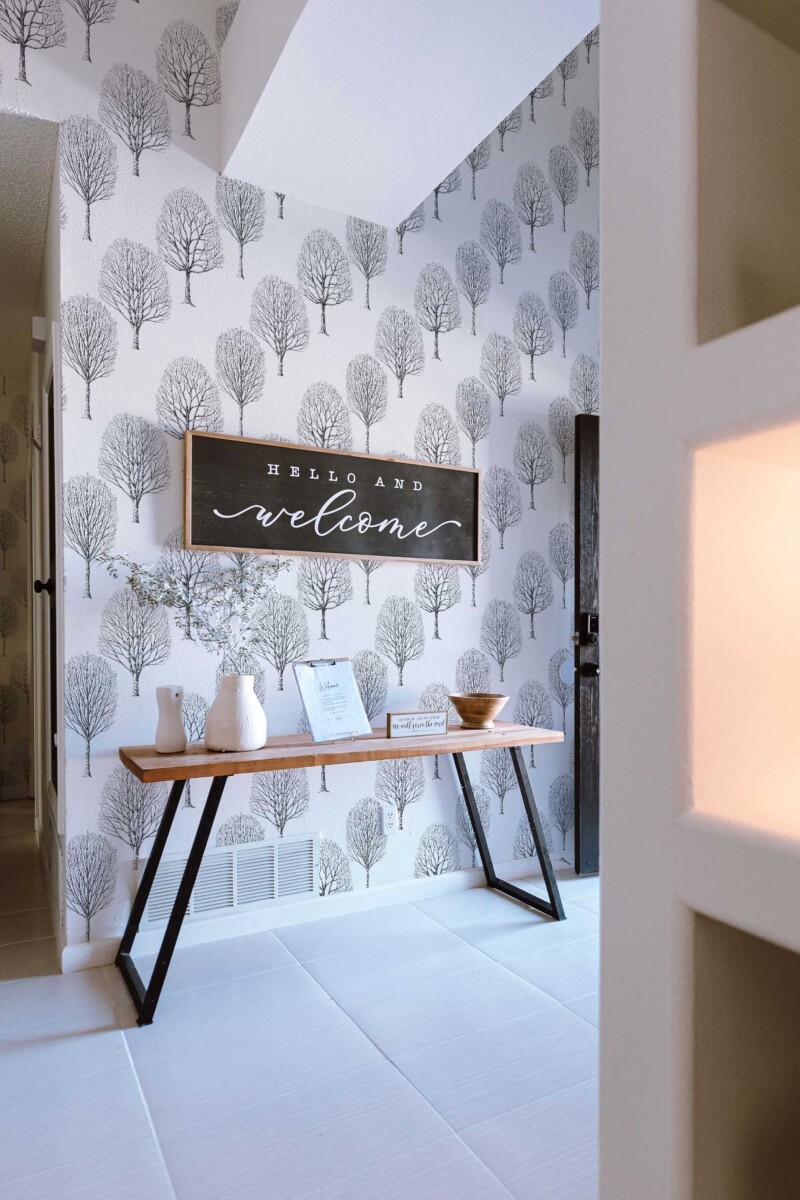 Fancy Walls self-adhesive wallpaper featuring minimalist birch silhouettes in black and white for serene interiors.