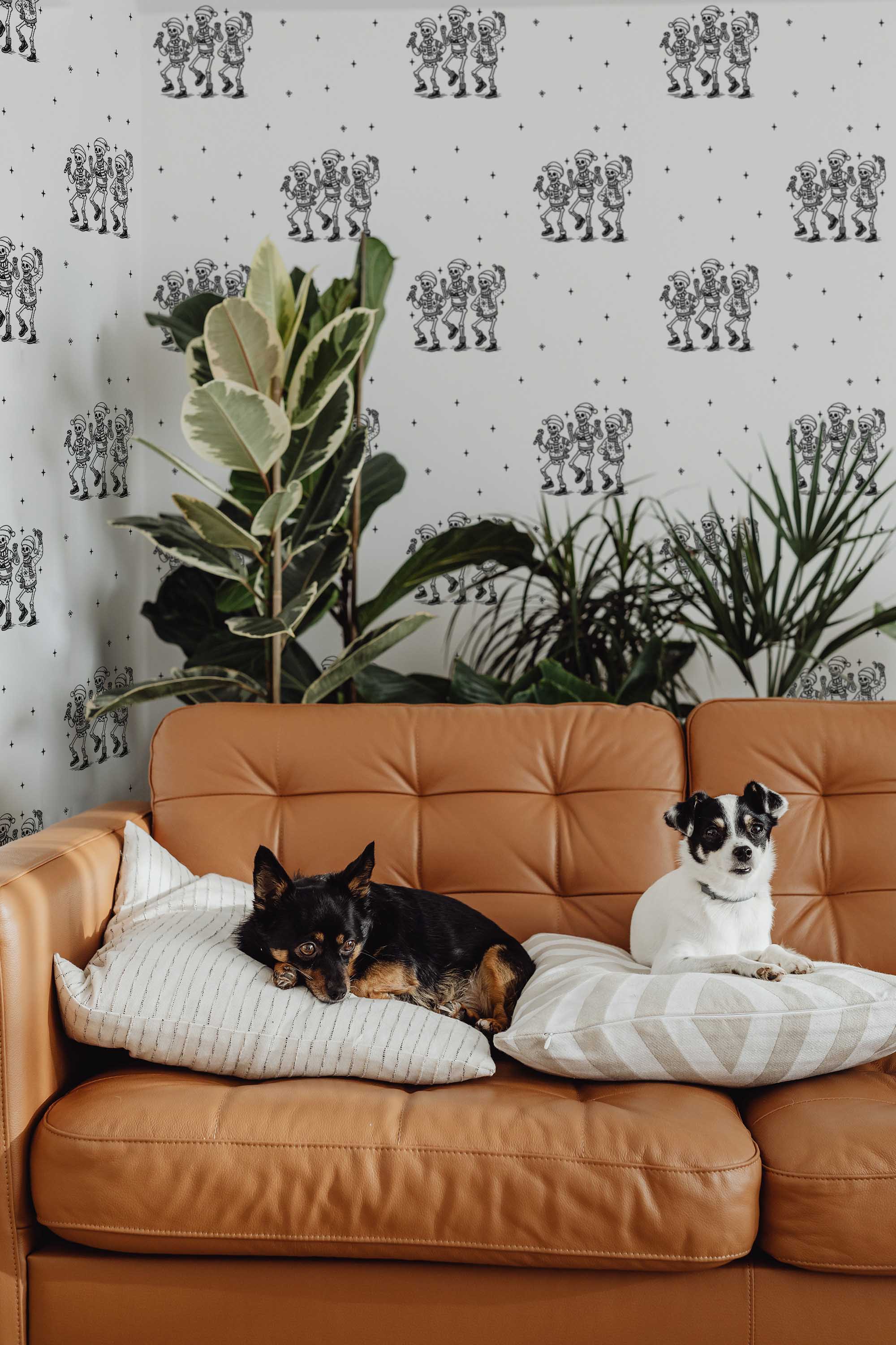 Fancy Walls self-adhesive wallpaper with monochrome skeleton pattern for a gothic holiday aesthetic.