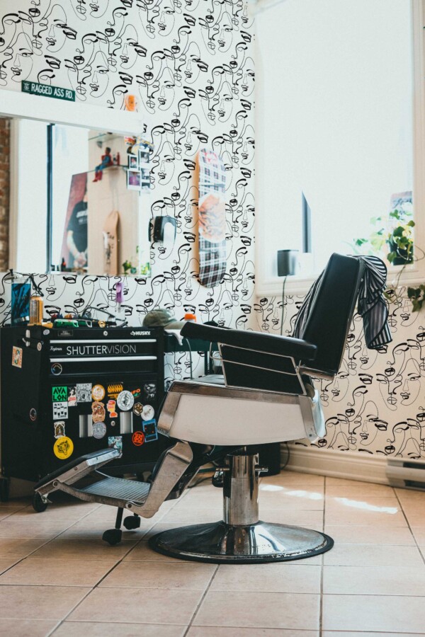 Fancy Walls removable wallpaper with abstract face line art for modern interiors.