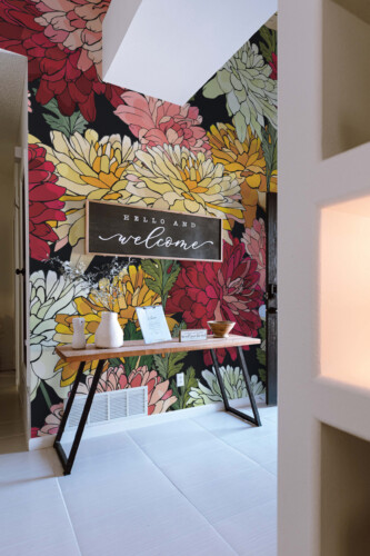 Bright Floral Garden wall mural by Fancy Walls featuring colorful hand-drawn flowers in pink, red, yellow, and cream peel and stick wall mural design