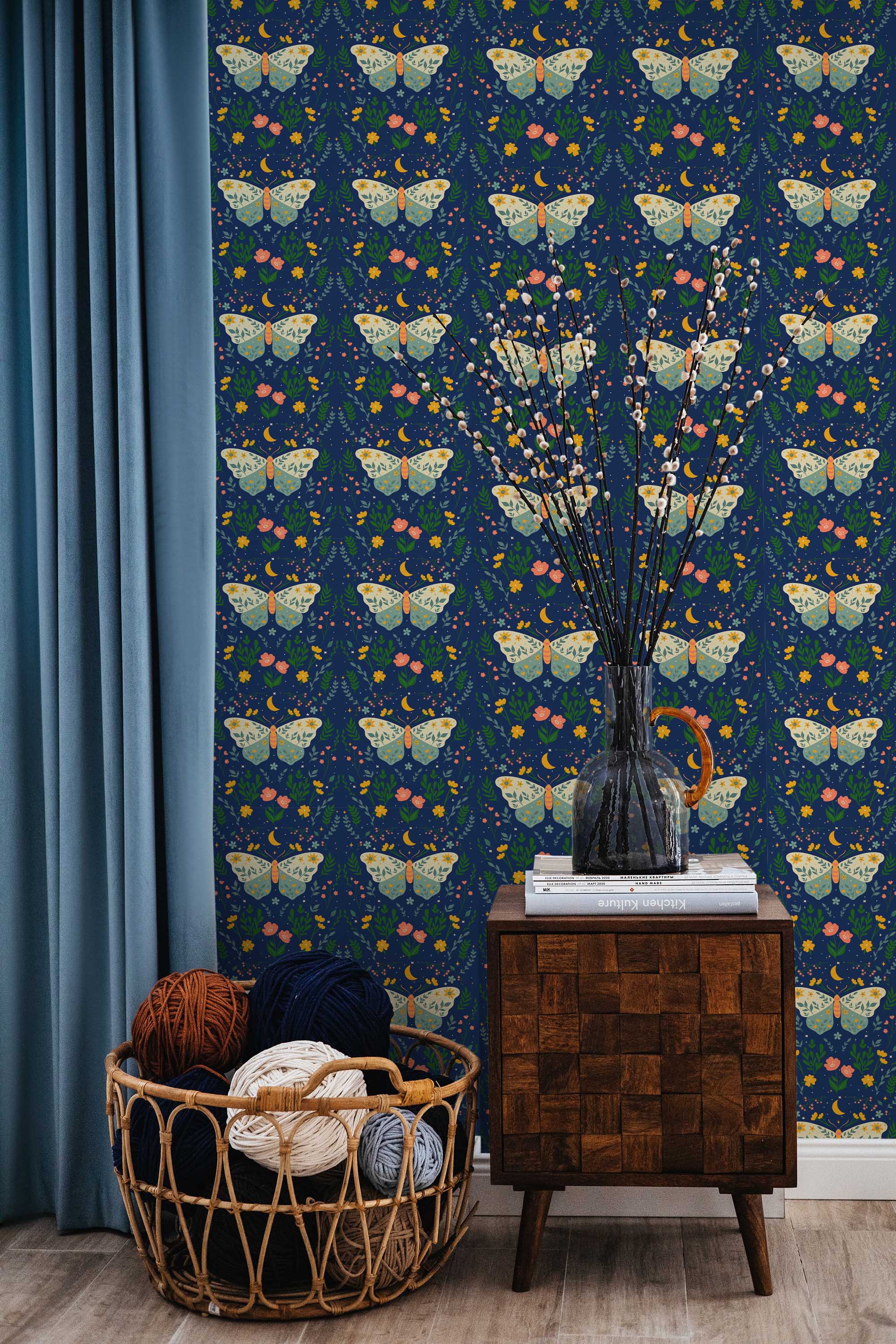 Fancy Walls peel and stick wallpaper with blue moths and butterflies on deep navy background.