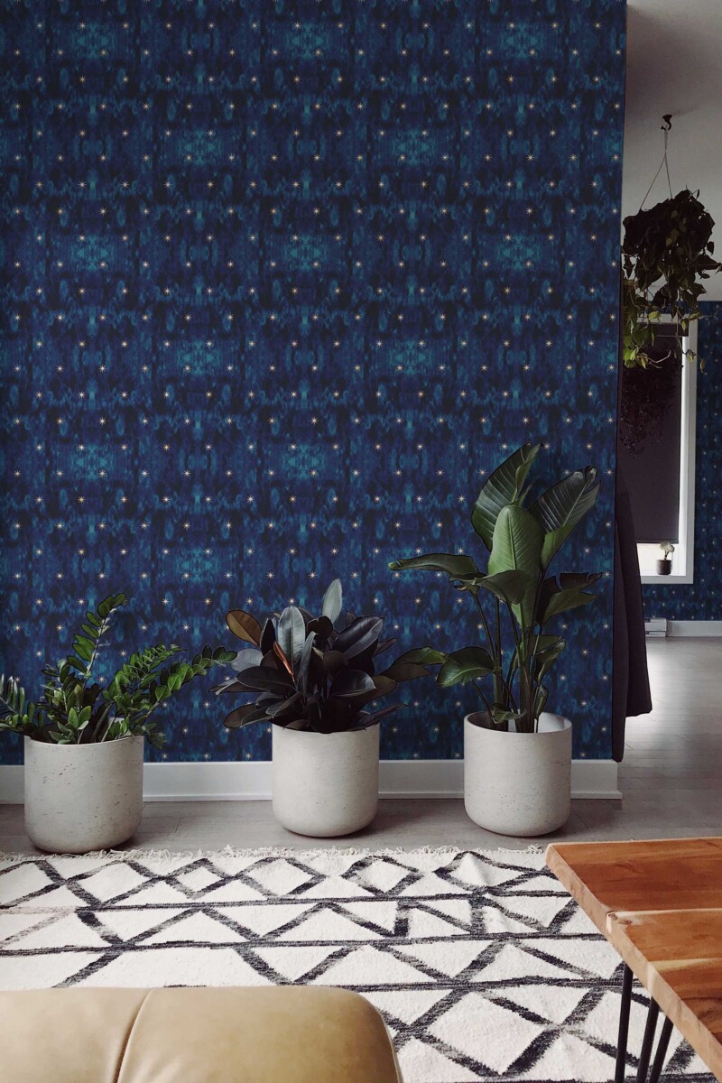 Fancy Walls self-adhesive wallpaper with blue star pattern creating a soft nighttime look for bedrooms. Midnight Glow Wallpaper peel and stick or non-pasted dark starry wallpaper for walls