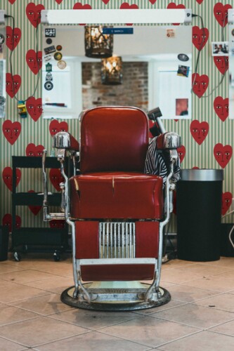 Fancy Walls traditional wallpaper featuring sage green stripes with cute crying hearts.