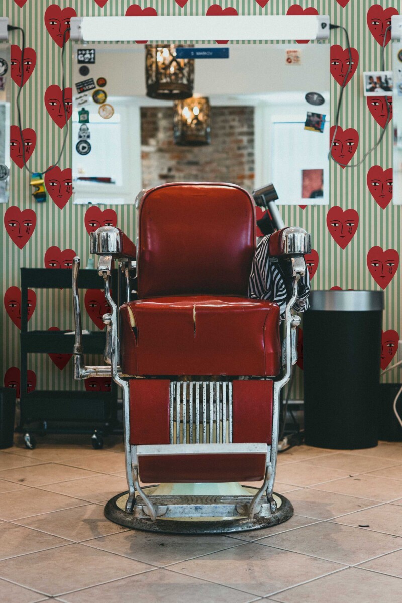 Fancy Walls traditional wallpaper featuring sage green stripes with cute crying hearts.
