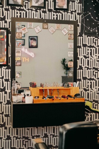 Fancy Walls peel and stick wallpaper featuring black and white gothic lettering pattern.