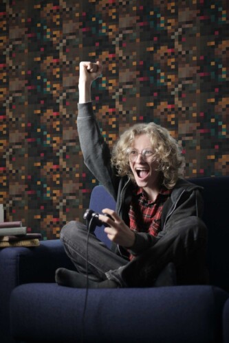 Fancy Walls peel and stick wallpaper with brown earthy pixel geometric design.