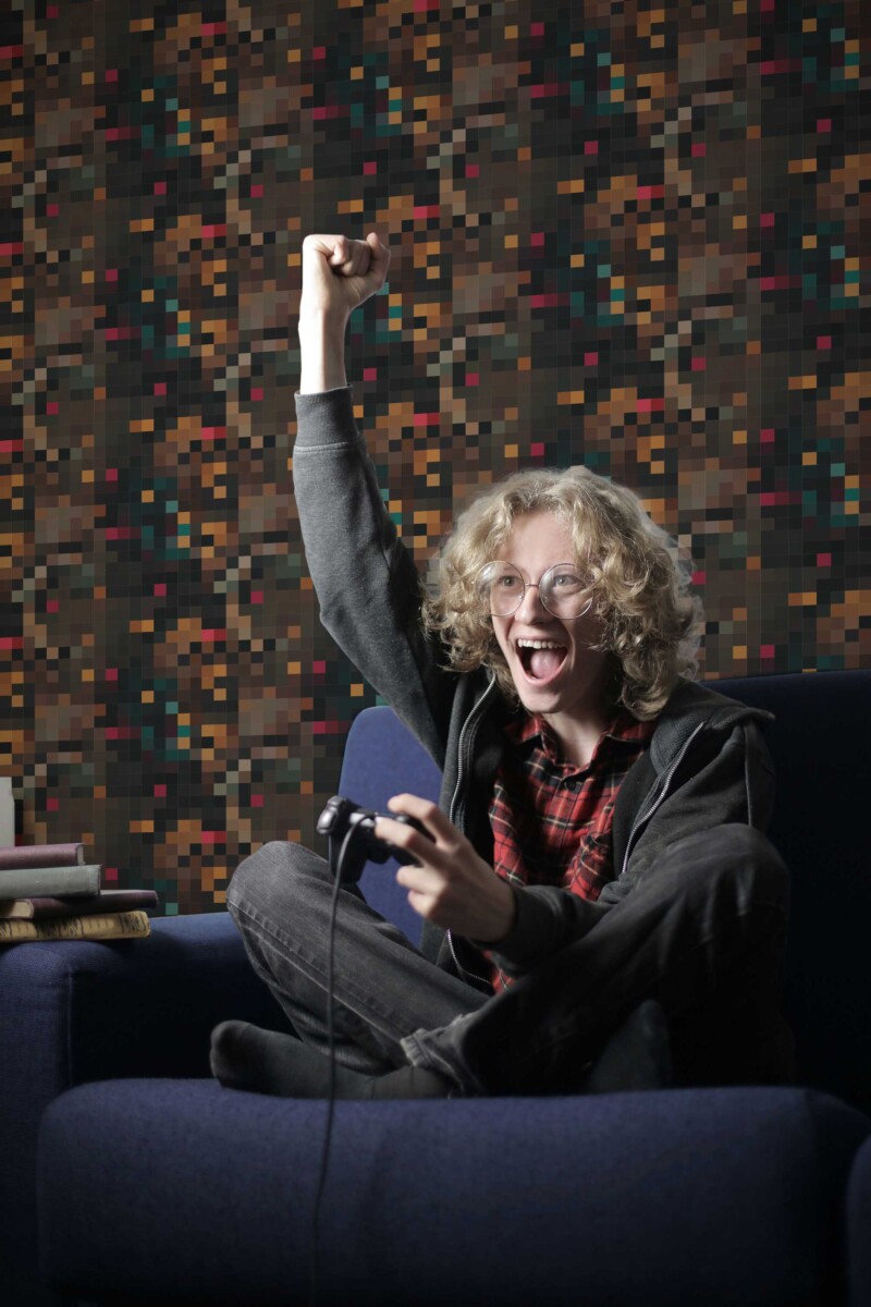 Fancy Walls peel and stick wallpaper with brown earthy pixel geometric design.