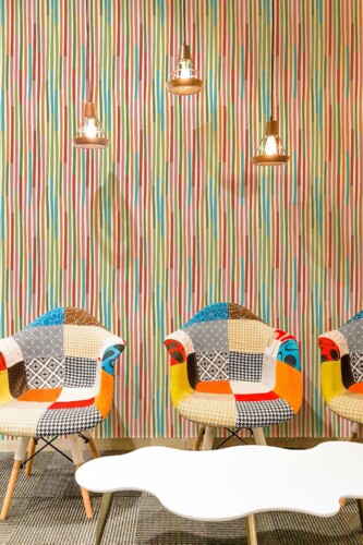 Fancy Walls removable wallpaper with playful blue green and pink striped pattern. Cute Stripes peel and stick or non-pasted PVC-free and eco-friendly funny bright wallpaper