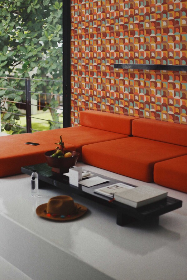Fancy Walls removable wallpaper with warm terracotta retro shapes.
