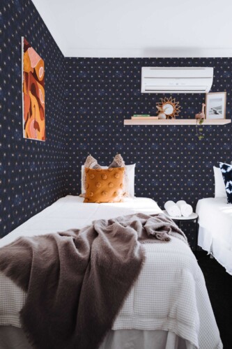 Fancy Walls removable wallpaper with dark blue gothic star pattern.