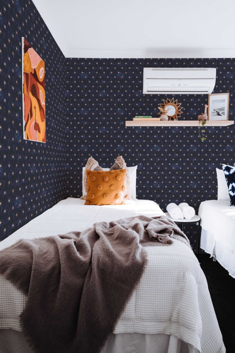 Fancy Walls removable wallpaper with dark blue gothic star pattern.