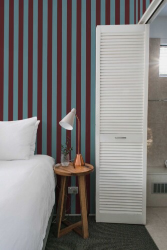 Fancy Walls traditional wallpaper inspired by classic burgundy striped design.