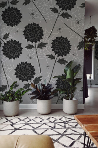 Noir Blooms and Spiders wall mural by Fancy Walls featuring black gothic flowers with spiderwebs on a grey-beige background peel and stick wall mural design