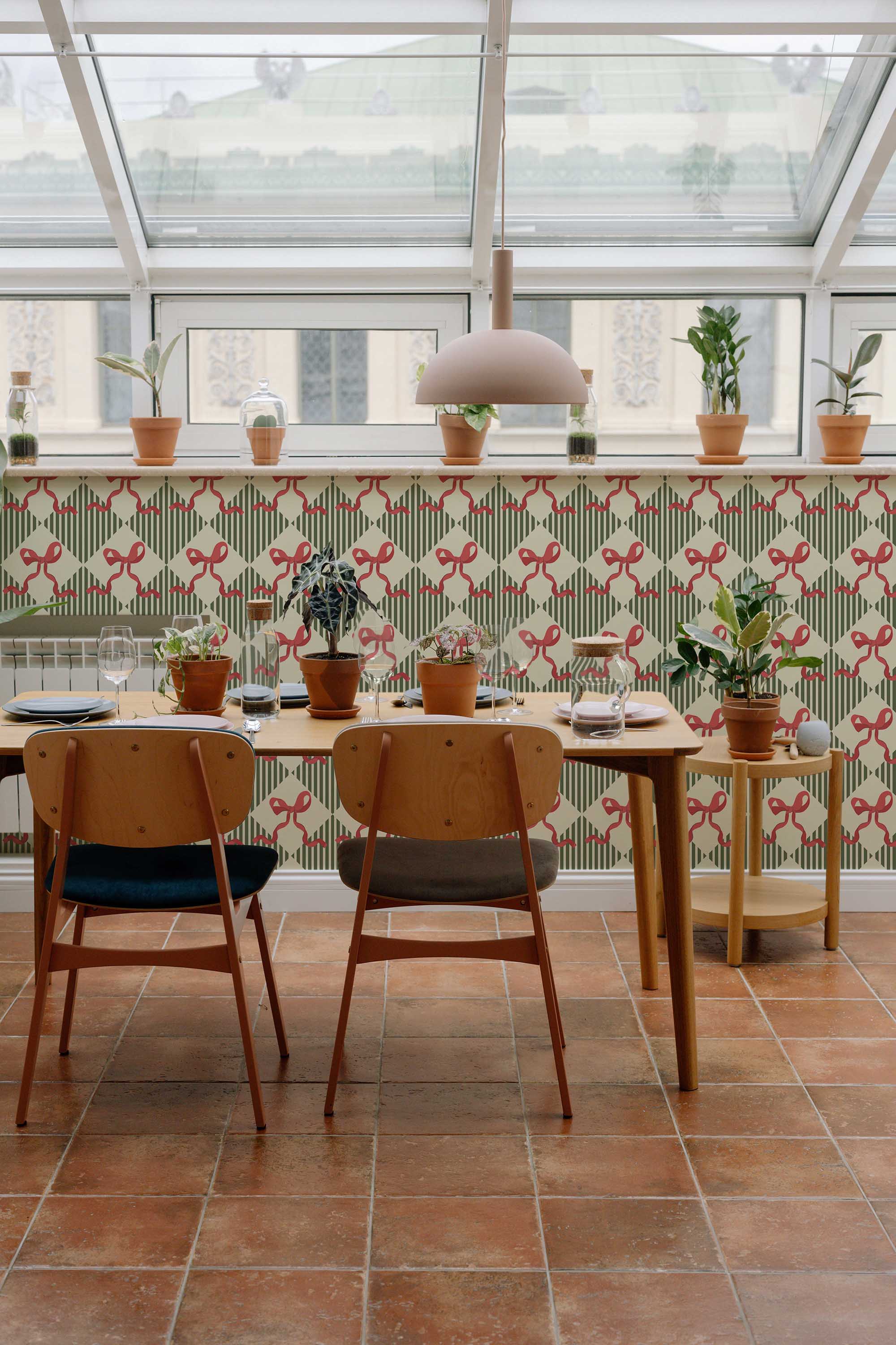 Fancy Walls traditional wallpaper inspired by vintage ribbon giftwrap design in green hues.