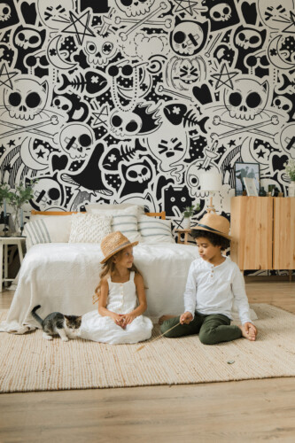 Halloween Graffiti wall mural by Fancy Walls featuring monochrome skulls, ghosts, and witch hats in graffiti style perfect for modern interiors peel and stick wall mural design
