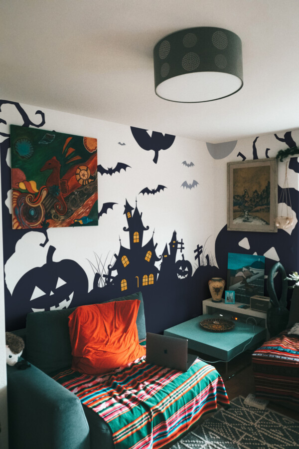 Fancy Walls Spooky Pumpkins wall mural peel and stick with glowing orange windows, crooked trees, and bats flying under the moonlight