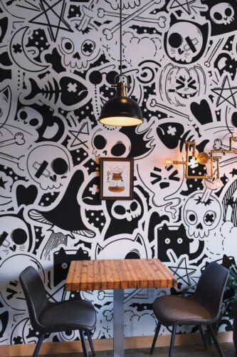 Halloween Graffiti wall mural by Fancy Walls filled with spooky skull motifs and hand-drawn doodles creating a unique street-art atmosphere wall mural peel and stick finish