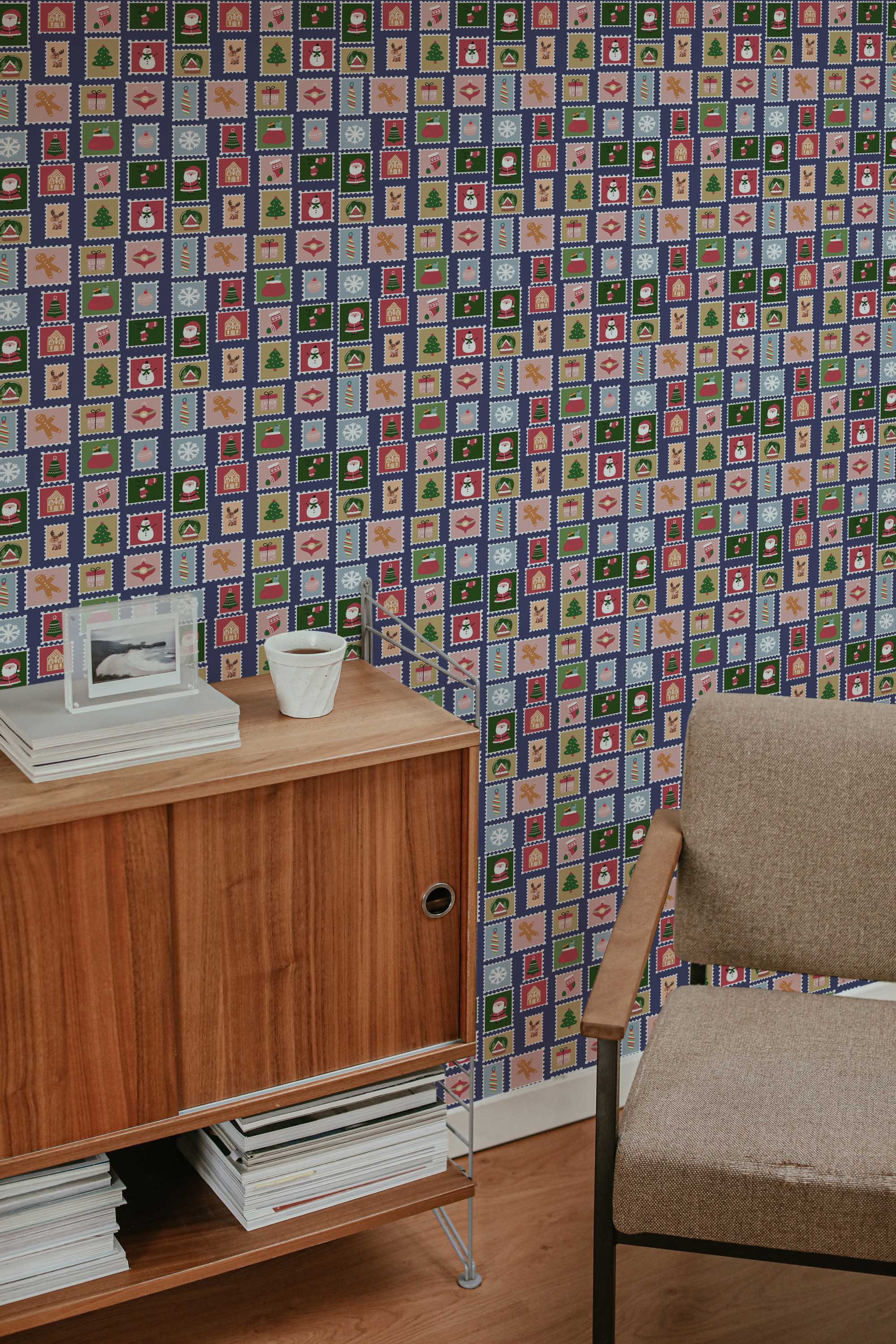 Fancy Walls traditional wallpaper with green geometric postmark pattern for vintage holiday style.