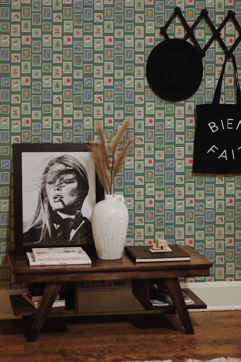 Fancy Walls traditional wallpaper with green squares and nostalgic winter stamp illustrations.
