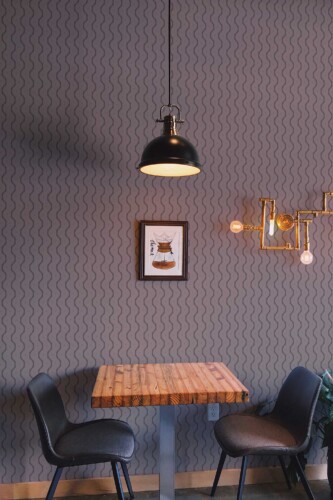 Fancy Walls traditional wallpaper featuring trending wavy brown and purple lines.