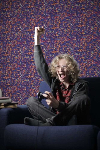 Fancy Walls self-adhesive wallpaper featuring vibrant purple geometric pixel design.