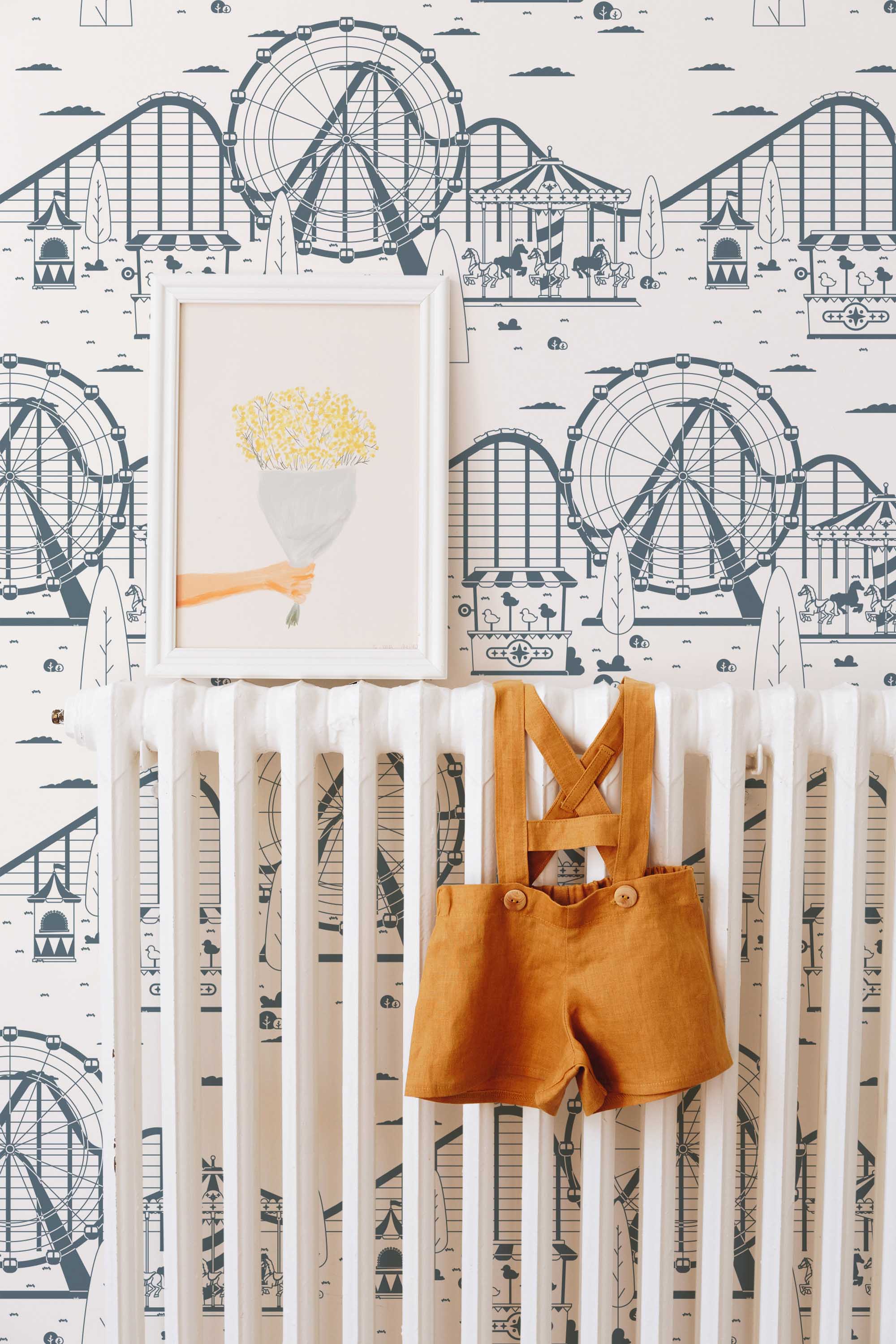 Fancy Walls traditional wallpaper with nostalgic amusement park icons in navy and cream hues.