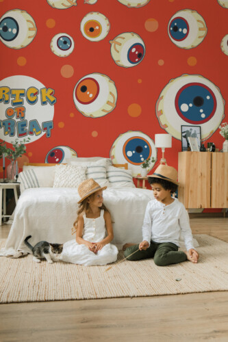 Trick or Treat Eyes wall mural by Fancy Walls featuring playful cartoon eyeballs on orange background peel and stick wall mural